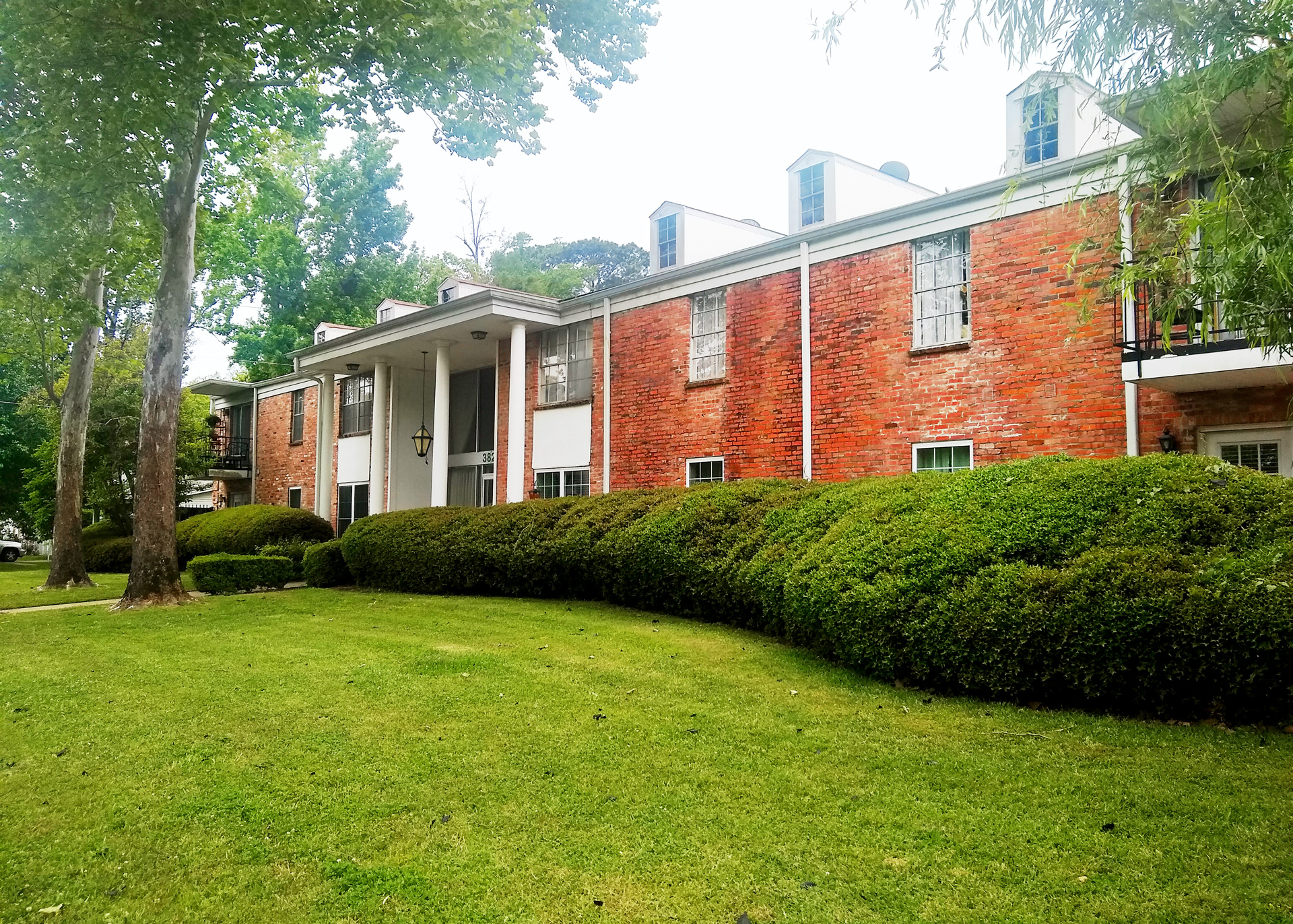 Fairfield Oaks brick buildings surrounded by trees